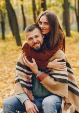 Man and woman sitting together outdoors