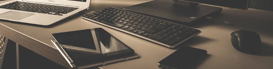 Office desk setup with multiple digital devices